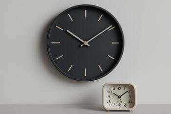 Matte minimal wall clock paired with soft-tone desk alarm