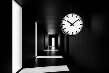 High-contrast hall with railway clock